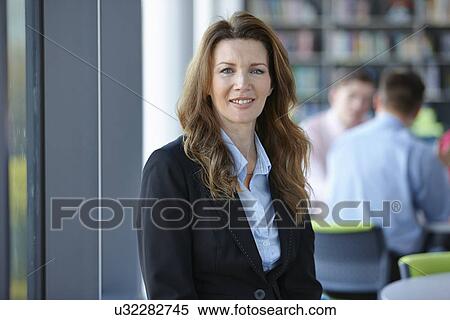 Portrait of mature businesswoman with long hair View Large Photo Image Stock Photography - Portrait of mature businesswoman with long hair. Fotosearch