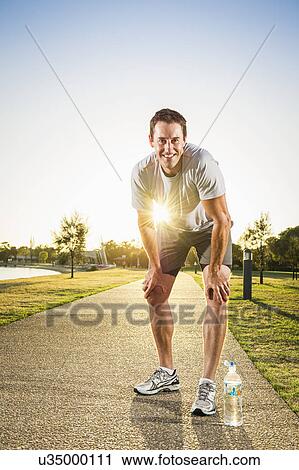 Portrait of mature male runner taking a break View Large Photo Image Stock Image - Portrait of mature male runner taking a break. Fotosearch