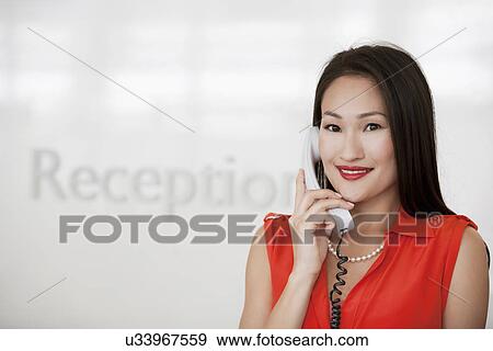 Portrait of receptionist in office View Large Photo Image Stock Photo - Portrait of receptionist in office. Fotosearch