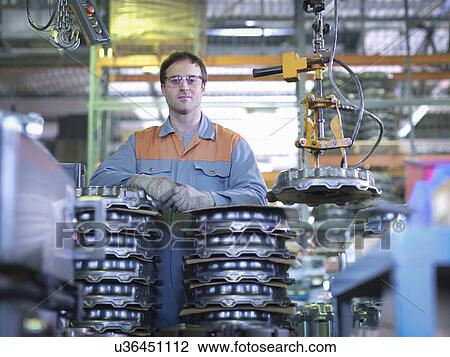 Portrait of worker on production line in industrial clutch factory View Large Photo Image Stock Image - Portrait of worker on production line in industrial clutch factory. Fotosearch
