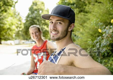 Portrait of young basketball players sitting on park bench View Large Photo Image Stock Image - Portrait of young basketball players sitting on park bench. Fotosearch