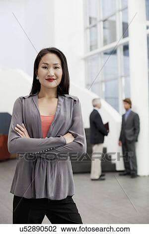 Portrait of young businesswoman in office atrium View Large Photo Image Stock Image - Portrait of young businesswoman in office atrium. Fotosearch
