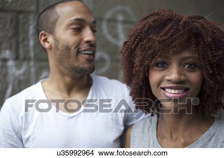 Picture - Portrait of young couple smiling. Fotosearch