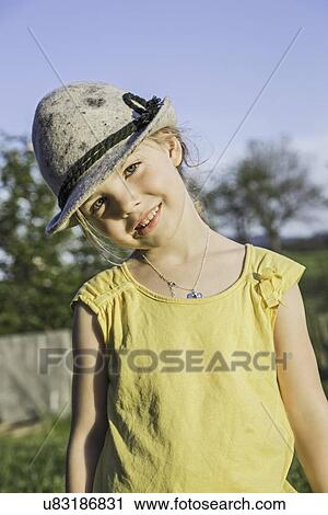 Portrait of young girl in alpine hat View Large Photo Image Stock Image - Portrait of young girl in alpine hat. Fotosearch