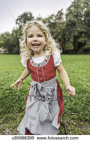 Portrait of young girl in traditional Bavarian costume View Large Photo Image Stock Photo - Portrait of young girl in traditional Bavarian costume. Fotosearch