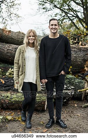 Portrait of young happy couple in woods View Large Photo Image Stock Photo - Portrait of young happy couple in woods. Fotosearch