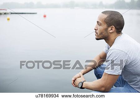 Portrait of young man by lake View Large Photo Image Picture - Portrait of young man by lake. Fotosearch