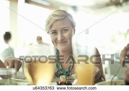 Portrait of young woman in cafe bar View Large Photo Image Stock Image - Portrait of young woman in cafe bar. Fotosearch
