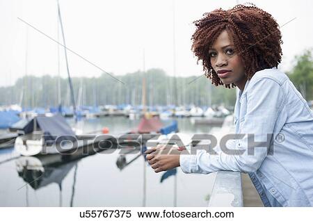 Portrait of young woman in marina View Large Photo Image Stock Photography - Portrait of young woman in marina. Fotosearch