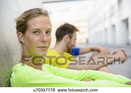 Stock Photo - Portrait of young woman looking at camera. Fotosearch