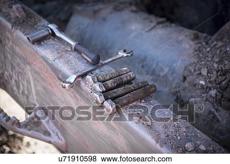Stock Photo - Repairs being made to bulldozer tracks at surface coal mine. Fotosearch