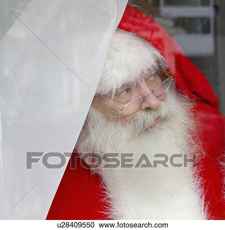 Santa Claus looking out of window View Large Photo Image Stock Image - Santa Claus looking out of window. Fotosearch