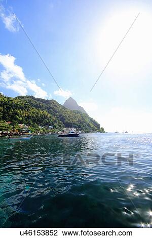Stock Image - Sea and boat, St Lucia, Caribbean. Fotosearch