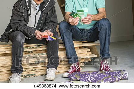 Senior couple comparing color charts View Large Photo Image Picture - Senior couple comparing color charts. Fotosearch