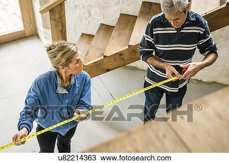Senior couple doing DIY, using measuring tape View Large Photo Image Stock Image - Senior couple doing DIY, using measuring tape. Fotosearch