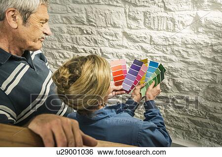 Senior couple holding colour charts View Large Photo Image Stock Photograph - Senior couple holding colour charts. Fotosearch