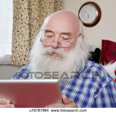 Senior man using digital tablet View Large Photo Image Picture - Senior man using digital tablet. Fotosearch