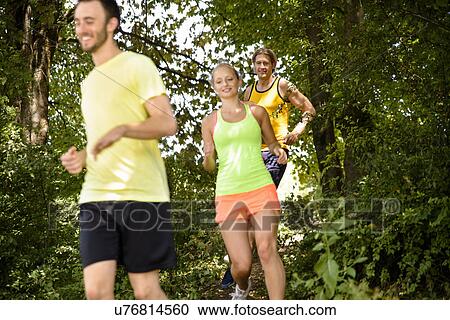 Small group of runners training in woods View Large Photo Image Stock Image - Small group of runners training in woods. Fotosearch