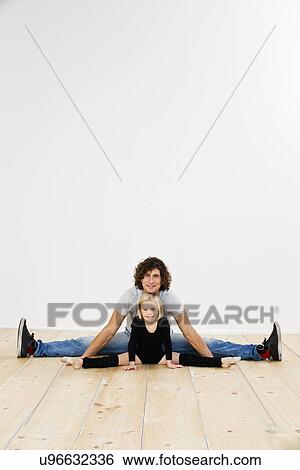 Studio portrait of father and ballerina daughter doing splits View Large Photo Image Stock Photograph - Studio portrait of father and ballerina daughter doing splits. Fotosearch