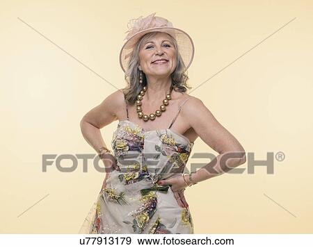 Studio portrait of glamorous senior woman View Large Photo Image Stock Photo - Studio portrait of glamorous senior woman. Fotosearch