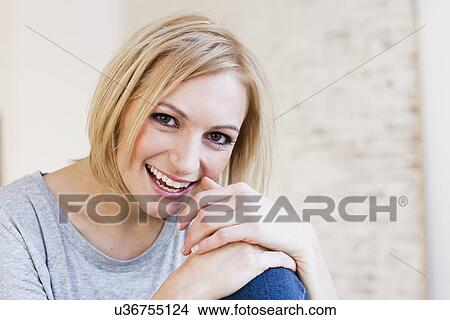 Studio portrait of smiling young woman View Large Photo Image Picture - Studio portrait of smiling young woman. Fotosearch