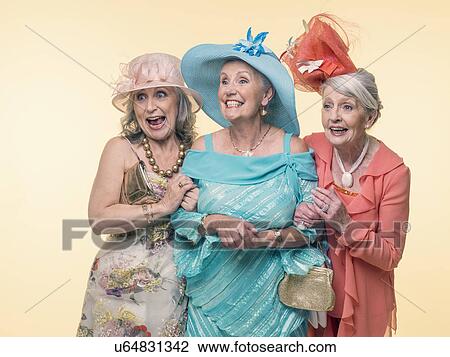 Studio portrait of three happy glamorous senior women View Large Photo Image Stock Image - Studio portrait of three happy glamorous senior women. Fotosearch