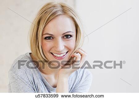 Studio portrait of young woman View Large Photo Image Stock Photo - Studio portrait of young woman. Fotosearch