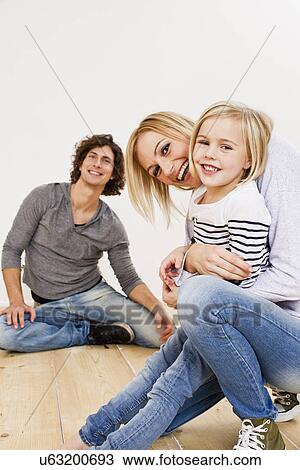 Studio shot of couple with daughter View Large Photo Image Stock Image - Studio shot of couple with daughter. Fotosearch