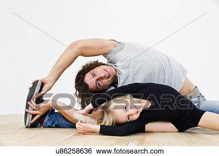 Stock Photograph - Studio shot of father and ballerina daughter doing splits. Fotosearch
