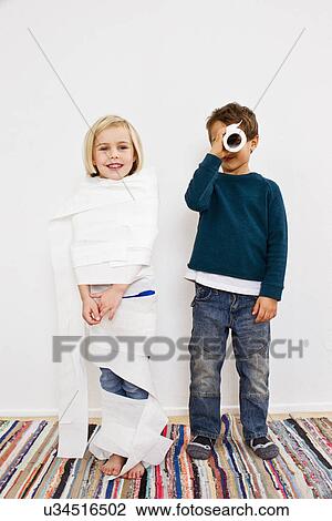 Studio shot of sister and brother with toilet rolls View Large Photo Image Stock Image - Studio shot of sister and brother with toilet rolls. Fotosearch
