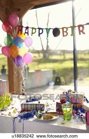 Table laid for birthday party with balloons and streamers View Large Photo Image Stock Image - Table laid for birthday party with balloons and streamers. Fotosearch