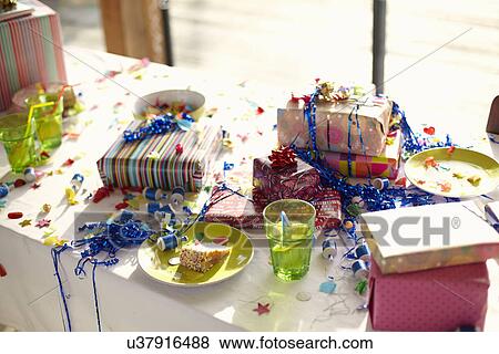 Table laid for birthday party with gifts and streamers View Large Photo Image Stock Photo - Table laid for birthday party with gifts and streamers. Fotosearch