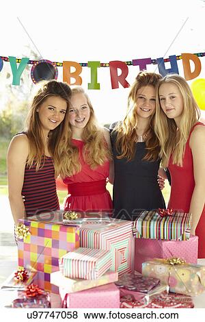Teenage girl and friends with birthday gifts View Large Photo Image Stock Photo - Teenage girl and friends with birthday gifts. Fotosearch