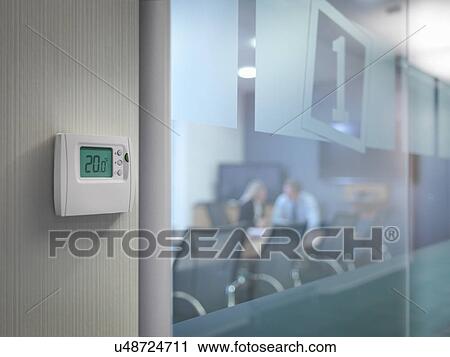 Thermostat outside conference room with office workers in meeting View Large Photo Image Stock Image - Thermostat outside conference room with office workers in meeting. Fotosearch