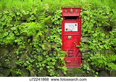 Stock Photo - Traditional red mailbox and dry stone wall, Yorkshire, UK. Fotosearch