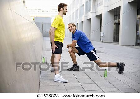 Stock Photo - Two men stretching. Fotosearch