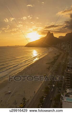View of Ipanema beach at sunset, Rio De Janeiro, Brazil View Large Photo Image Stock Photo - View of Ipanema beach at sunset, Rio De Janeiro, Brazil. Fotosearch