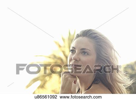 Stock Image - Woman daydreaming. Fotosearch