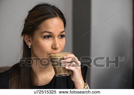 Woman drinking coffee View Large Photo Image Stock Photography - Woman drinking coffee. Fotosearch