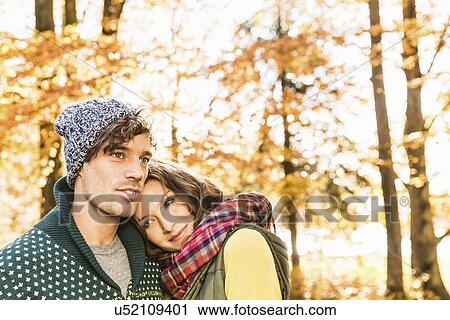 Stock Image - Woman with head on man's shoulder. Fotosearch
