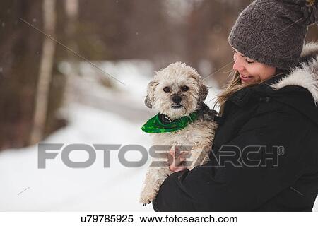 Stock Photography - Woman with pet dog outdoors. Fotosearch