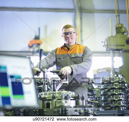 Worker assembling and testing clutches on rig in factory View Large Photo Image Stock Image - Worker assembling and testing clutches on rig in factory. Fotosearch
