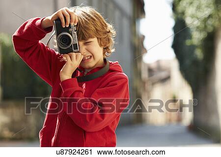 Young boy photographing on street, Province of Venice, Italy View Large Photo Image Stock Image - Young boy photographing on street, Province of Venice, Italy. Fotosearch