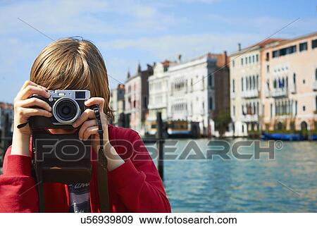 Young boy taking photographs, Venice, Italy View Large Photo Image Stock Photo - Young boy taking photographs, Venice, Italy. Fotosearch