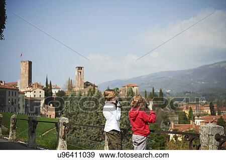Young brothers photographing from park, Province of Venice, Italy View Large Photo Image Stock Photo - Young brothers photographing from park, Province of Venice, Italy. Fotosearch