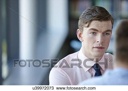 Stock Image - Young businessman in shirt and tie. Fotosearch