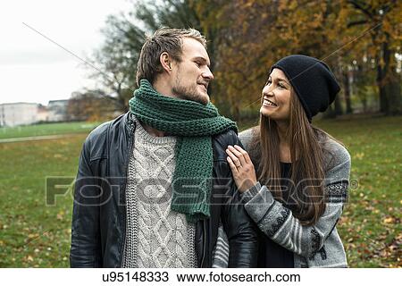 Young couple chatting in woods View Large Photo Image Stock Image - Young couple chatting in woods. Fotosearch