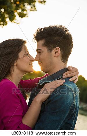 Stock Photo - Young couple embracing, Paris, France. Fotosearch