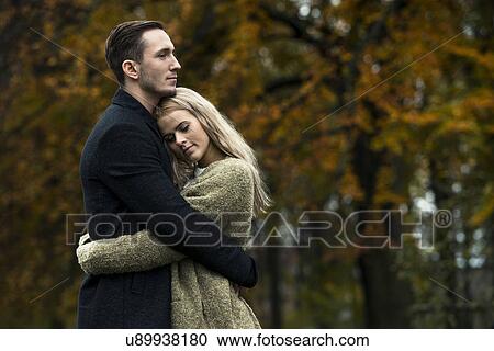 Young couple hugging in woods View Large Photo Image Stock Image - Young couple hugging in woods. Fotosearch