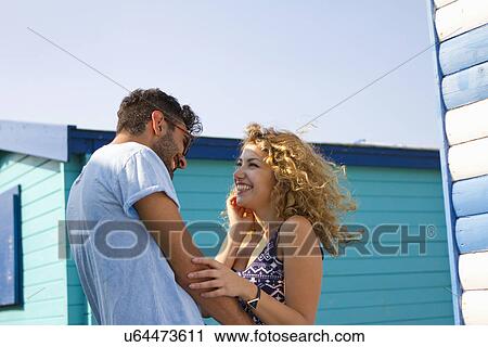 Young couple laughing View Large Photo Image Stock Image - Young couple laughing. Fotosearch